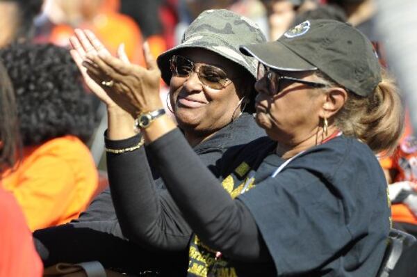 Joslyn Solomon looks at Ora Mann Hunter as she claps for a speaker at Black Voters Matter's Freedom Ride event, which gives voters rides to the polls, on Sunday, October 28, 2018. Hunter says she attended the event to support LaTosha Brown, co-founder of Black Voters Matter. (Photo: Jenna Eason / Contributed)