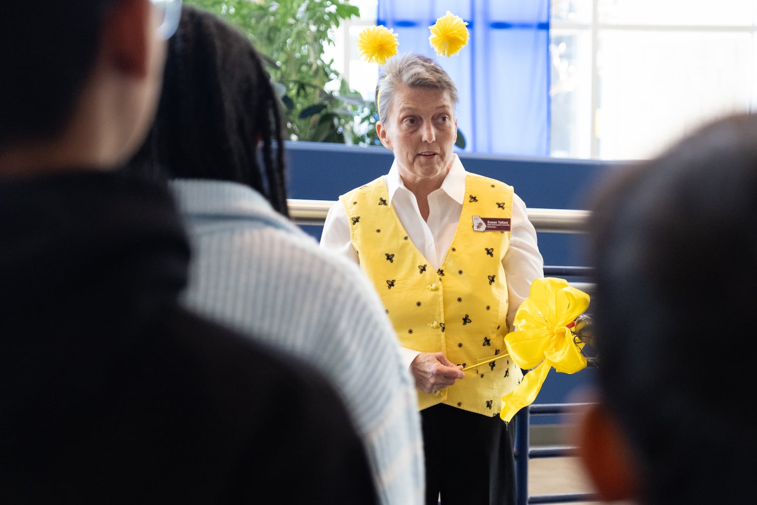 Susan Tallant, chair of the GAE State Spelling Bee, talks with contestants before the start of the championship at Georgia State University in Atlanta on Friday, March 21, 2025.   Ben Gray for the Atlanta Journal-Constitution