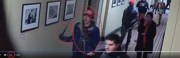 In the FBI's criminal complaint against 18-year-old Bruno Cua of Milton, Cua is identified in a U.S. Capitol surveillance video swinging what appears to be a baton.