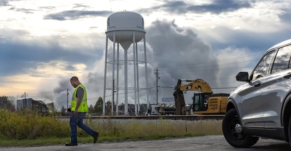 Rockdale County residents, especially those with respiratory problems, were told to shelter in place again Tuesday if a large cloud of smoke from a Conyers chemical plant fire moves into their vicinity.