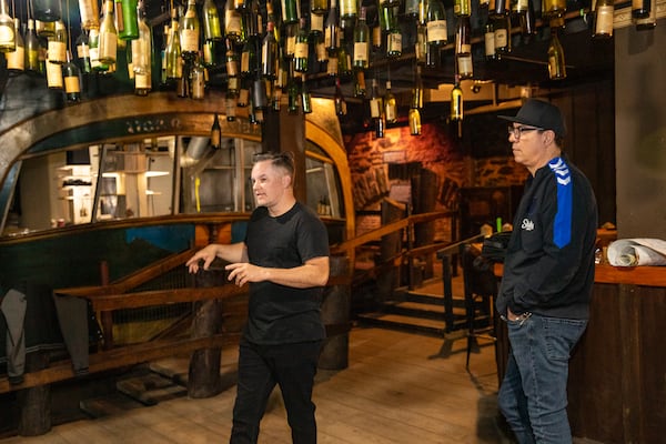 MJQ is moving to the Dante's Down the Hatch space in Underground Atlanta sitting empty for 25 years, and the owners, Ryan Purcell, left, and Ryan Murphy, right, are touring the space and sharing a little of what is in the planning stages on Monday, Feb 27, 2023. (Jenni Girtman for The Atlanta Journal-Constitution)