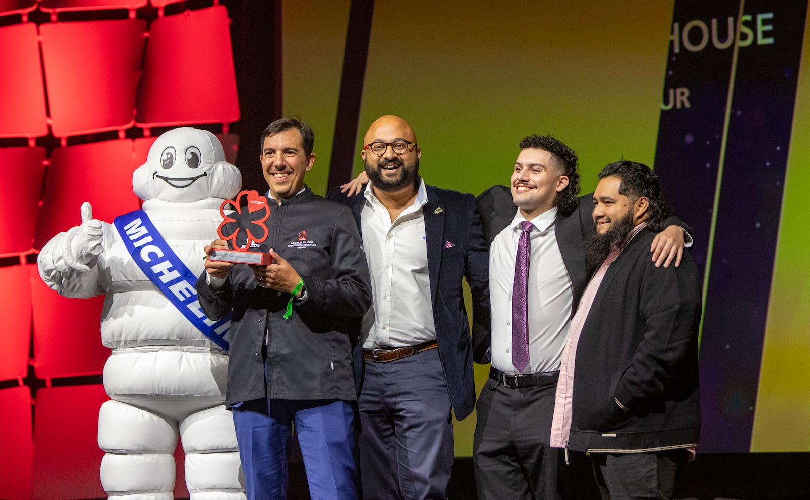 The Michelin Guide Awards take place at the Georgia World Congress Center on Monday, Oct 28, 2024, where Miles Macquarrie (second from left) of Kimball House is awarded the Exceptional Cocktails Award. (Jenni Girtman for the AJC)