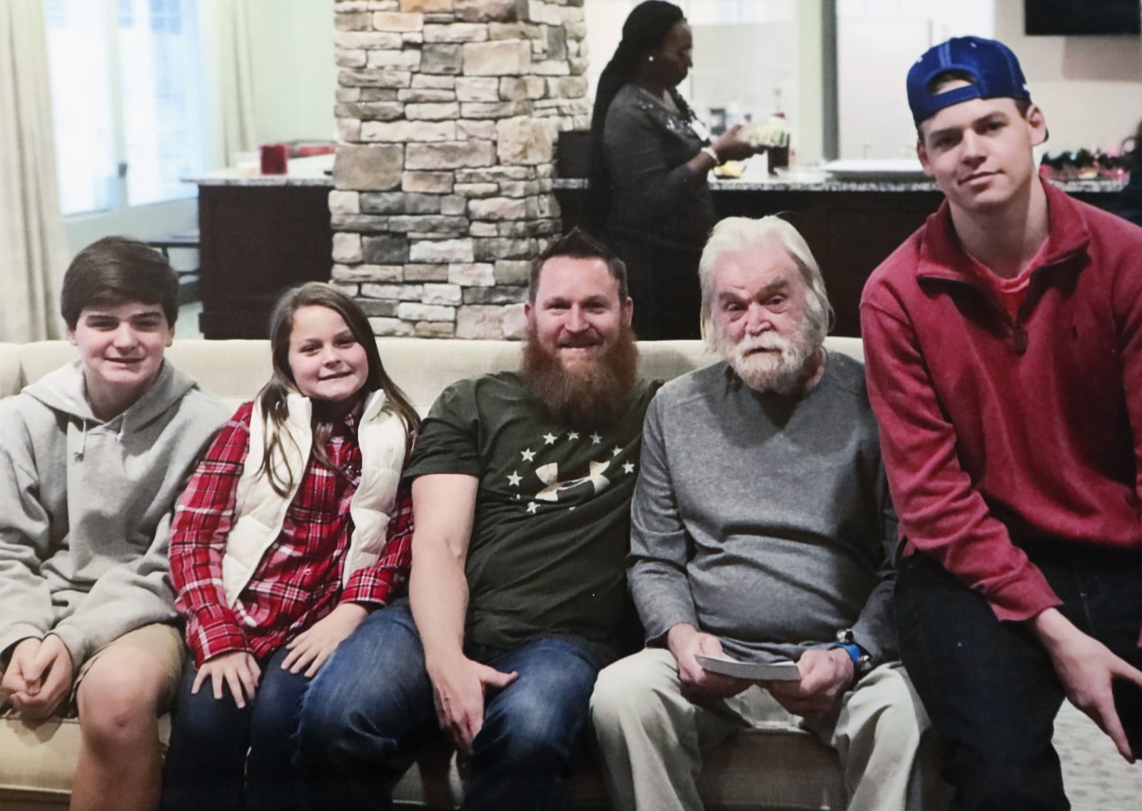 Ronald West (second from the right) pictured at Provident Village at Creekside with his son and grandchildren: Guy (from left), Ali, Jobe (son), and Dylan (far right). Ronald West died 19 days after a scuffle with a male caregiver at the facility. The facility said Ronald West hit the caregiver, who then pushed him in self-defense, but police at the time did little to conduct an independent review of the case. Bob Andres / robert.andres@ajc.com