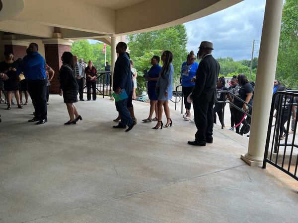 A procession of family and friends honors 72-year-old Calvin Varnum at the Jefferson Civic Center on Wednesday.