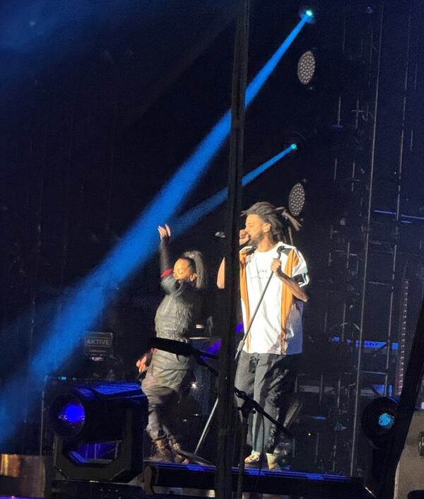 J Cole joins headliner Janet Jackson on stage at ONE Musicfest on Saturday night, Oct. 28, 2023, at Atlanta's Piedmont Park. (Leon Stafford/AJC)