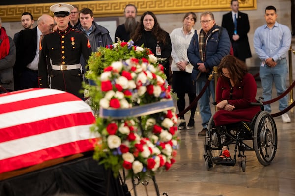 U.S. Sen. Tammy Duckworth (right), an Illinois Democrat, was among those paying respects to the late President Jimmy Carter at the Capitol Rotunda in Washington on Wednesday.