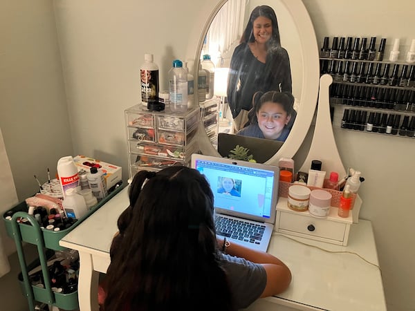 Anjelah Salazar logs into her weekly virtual therapy sessions with the help of her mom, Rosanna Chavira. (Molly Castle Work/KFF Health News/TNS)