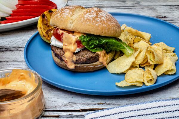 Lamb Burger with feta cheese, lettuce, tomato and spicy harissa mayonnaise 
(Virginia Willis for The Atlanta Journal-Constitution)