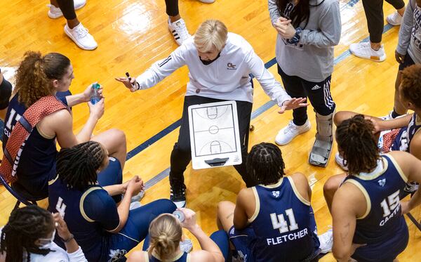 Georgia Tech coach Nell Fortner talks with players during a timeout in the second half of the team's college basketball game against West Virginia in the second round of the NCAA women's tournament at the UTSA Convocation Center in San Antonio on Tuesday, March 23, 2021. (AP Photo/Stephen Spillman)