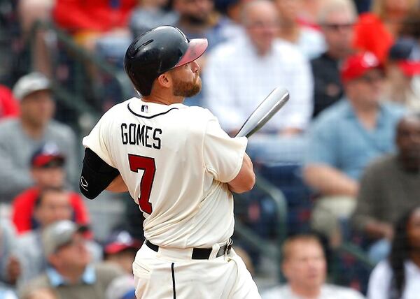 Atlanta Braves' Jonny Gomes hits a home run in the seventh inning of a baseball game against the New York Met, Sunday, April 12, 2015, in Atlanta. (AP Photo/Todd Kirkland) Jonny Gomes admires his circuit clout Sunday. (AP Photo/Todd Kirkland)