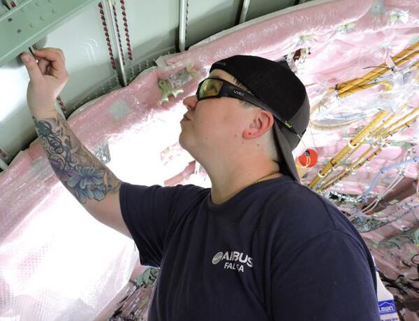 An employee at the Airbus plant in Mobile works on an aircraft. The plant assembles the European company’s smaller passenger jets.