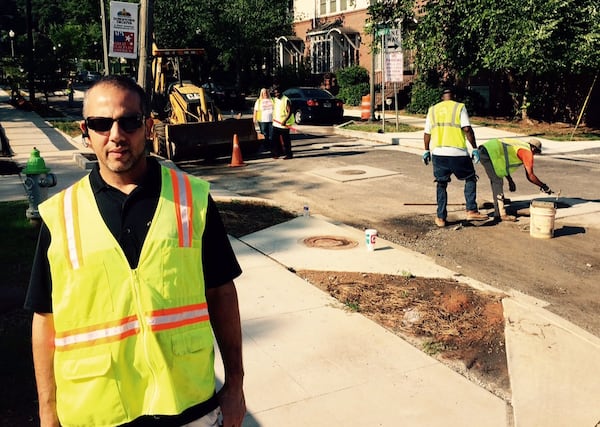 Contractor Alessandro Salvo jumped into a wet mess to help DeKalb County fix a huge water spill. But, he says, no good deed goes unpunished. (Photo by Bill Torpy / AJC 2015 file)