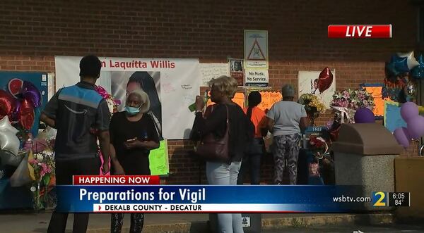 Customers and loved ones gathered for a candlelight vigil for the DeKalb County grocery store cashier.