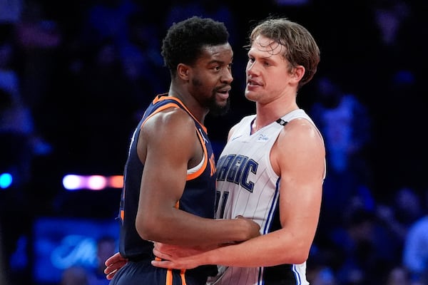 New York Knicks center Ariel Hukporti, left, and Orlando Magic center Moritz Wagner, right, hug following the second half of an NBA Cup basketball game, Tuesday, Dec. 3, 2024, in New York, N.Y. The Knicks won 121-106. (AP Photo/Julia Demaree Nikhinson)