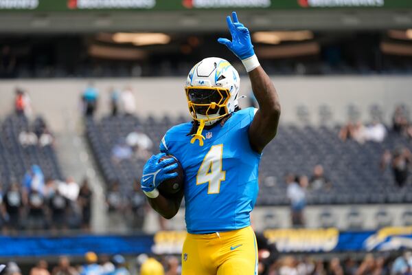 Los Angeles Chargers running back Gus Edwards works out before an NFL football game against the Las Vegas Raiders Tuesday, Sept. 10, 2024, in Inglewood, Calif. (AP Photo/Ashley Landis, File)