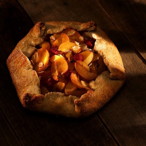 This Apricot Galette consists of a rolled edge crust with raspberries and shaved almonds. (Kirk McKoy/Los Angeles Times/TNS)