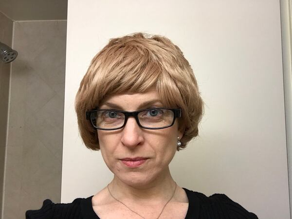 Bonnie Smyre, COO of Raxis, wears a wig and glasses before a job where she had to sneak into a business to test a client's security. (Contributed)