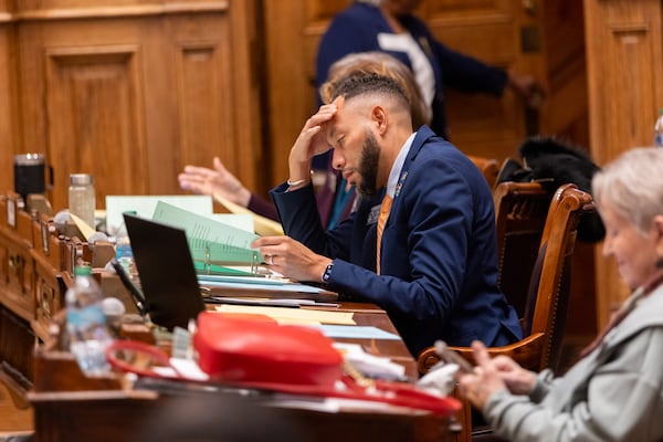 State Sen. RaShaun Kemp, D-Atlanta, reviews a bill in the Senate on Thursday at the Capitol. Arvin Temkar/AJC