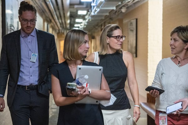 Sen. Kyrsten Sinema (D-Ariz.) walks into a vote on Capitol Hill in Washington, July 28, 2022. Now that Sen. Joe Manchin (D-W.Va.) is on board, the Arizona Democrat has emerged as the final holdout on Democrats’ domestic agenda. (Haiyun Jiang/The New York Times)