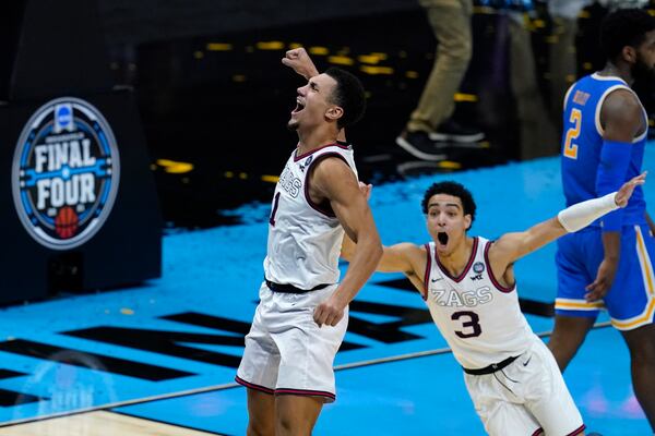 Gonzaga guard Jalen Suggs (1) celebrates making the game winning basket against UCLA during overtime in a men's Final Four NCAA college basketball tournament semifinal game, Saturday, April 3, 2021, at Lucas Oil Stadium in Indianapolis. Gonzaga won 93-90. (AP Photo/Darron Cummings)