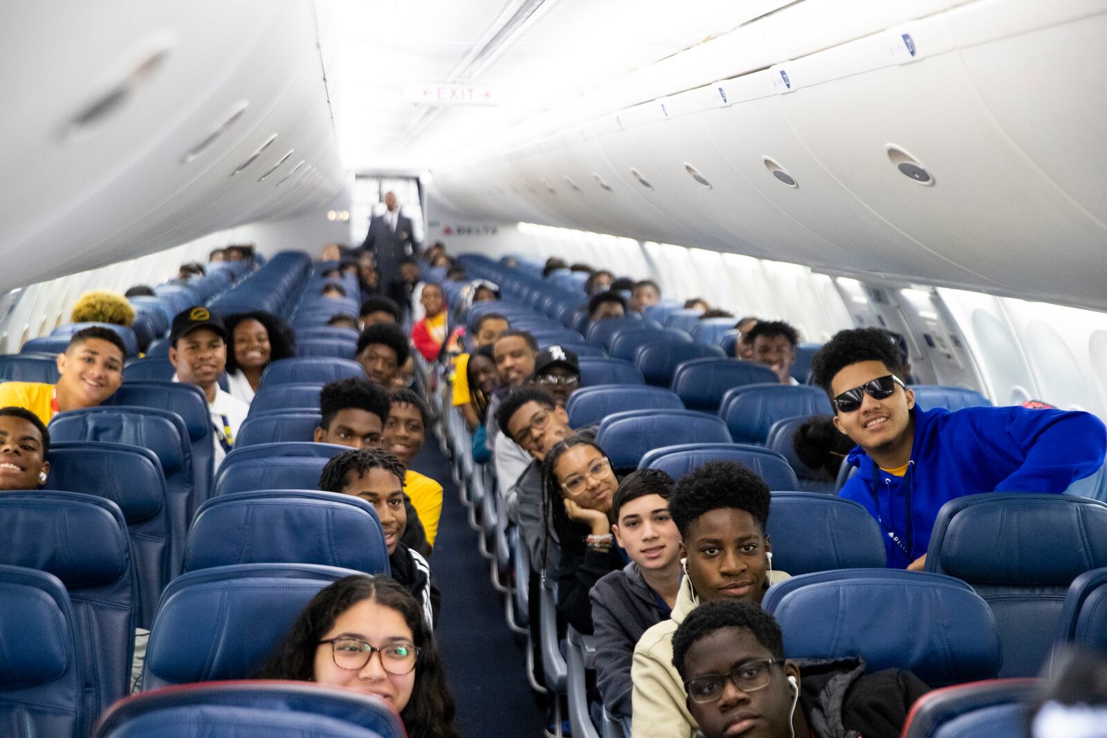 Participants of Delta’s Dream Flight 2022 pose for a photo aboard a plane at Hartsfield-Jackson Atlanta International Airport on Friday, July 15, 2022. Around 150 students ranging from 13 to 18 years old will fly from Atlanta to the Duluth Air National Guard Base in Duluth, Minnesota. (Chris Day/Christopher.Day@ajc.com)