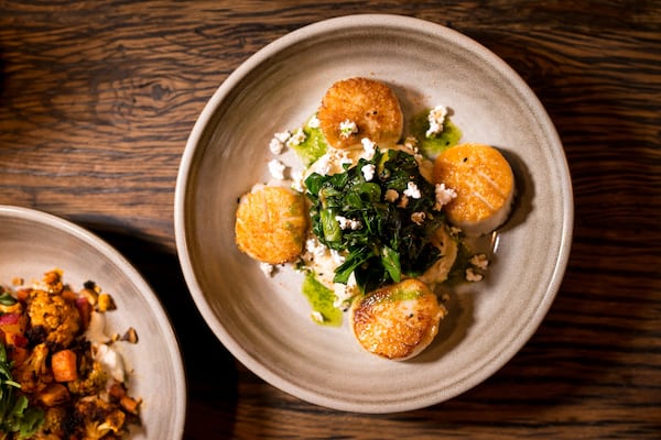 Pan Seared Diver Scallops with celeriac puree, swiss chard, popped sorghum, and shichimi-togarashi. Photo credit- Mia Yakel.