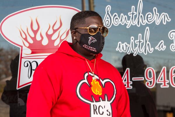 Renardo Lewis is outside his Marietta restaurant Tuesday, Dec 15, 2020. Lewis was charged with assaulting a police office in March 2019 and now, at the request of Cobb County prosecutors, a judge signed an order dropping all charges.  (Jenni Girtman for Atlanta Journal Constitution)