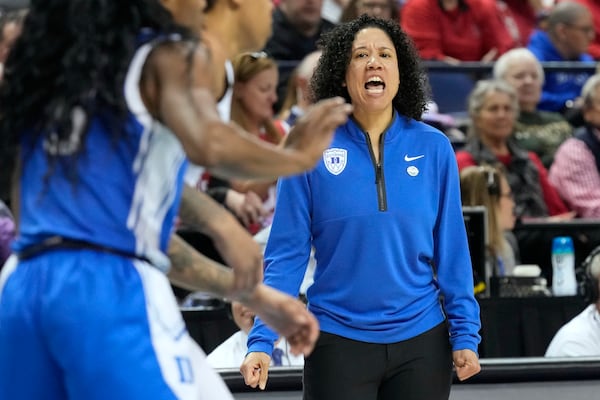 Duke head coach Kara Lawson directs her team against NC State during an NCAA college basketball game in the championship of the Atlantic Coast Conference tournament Greensboro, N.C., Sunday, March 9, 2025. (AP Photo/Chuck Burton)