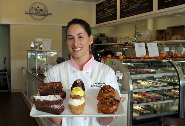 The Fig-in-Delicious sandwich, with organic fig jam, brie, Italian prosciutto ham, organic arugula and a balsamic glaze, is served with a basket of potato chips at Alaina's Bake Shoppe and Cafe in Palm Beach Gardens. (J. Gwendolynne Berry/The Palm Beach Post)