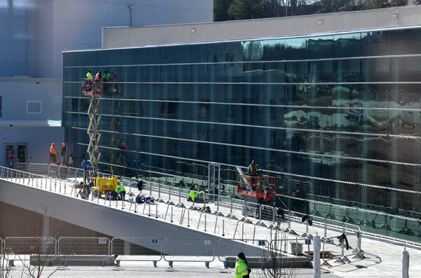 Construction crews work on the plaza as part of renovations of Gas South Convention Center Friday, Jan. 27, 2023, in Duluth. The older existing convention center space is now being renovated, a full-service hotel is being built on the Gas South district. (Hyosub Shin / Hyosub.Shin@ajc.com)