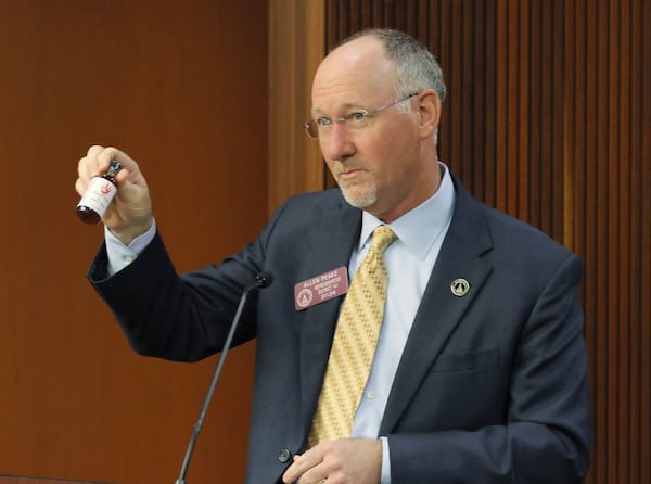 Feb. 20 2017 - Atlanta - Rep. Allen Peake holds a bottle of cannibis oil as he presents a medical marijuana update bill. It’s the first step toward passage in the House. (BOB ANDRES /BANDRES@AJC.COM)