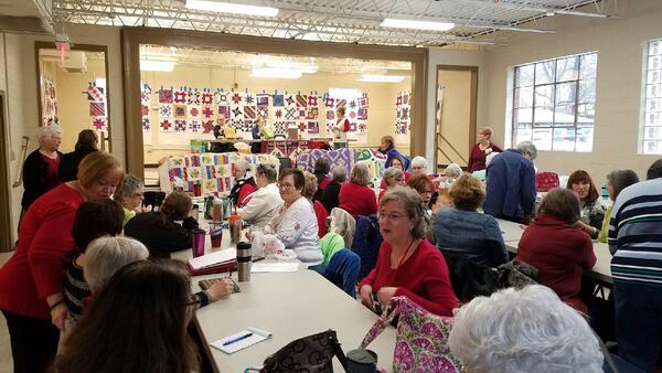 Members of the Allatoona Quilters Guild donated handmade quilts to the Acworth Police Department on Dec. 6, 2016.