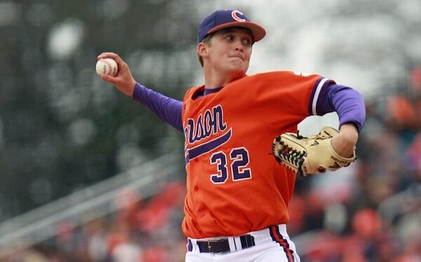 FILE - In this March 2, 2013 filephoto, Clemson's Clate Schmidt throws a pitch against South Carolina during an NCAA college baseball game at Fluor Field in Greenville, S.C. Schmidt threw 77 pitches in a win over Maine on Saturday, Feb. 19, 2016, six months after his cancer went into remission.  (Mark Crammer /The Independent-Mail via AP, File) THE GREENVILLE NEWS OUT, SENECA NEWS OUT; MANDATORY CREDIT