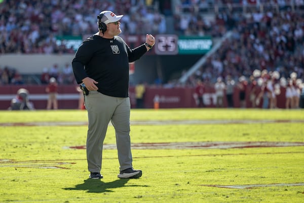 Mercer head coach Mike Jacobs argues a call with the game officials during the first half of an NCAA college football game against Alabama, Saturday, Nov. 16, 2024, in Tuscaloosa, Ala. (AP Photo/Vasha Hunt)