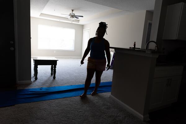 Marine Corps veteran Shkayla Moore, who was recently homeless, is seen in her new apartment in Marietta on Monday, Sept. 18, 2023. (Arvin Temkar / arvin.temkar@ajc.com)