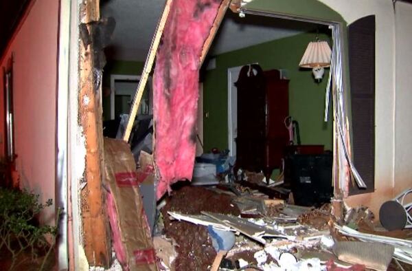 The SUV crashed into a woman’s DeKalb County condominium Thursday night.