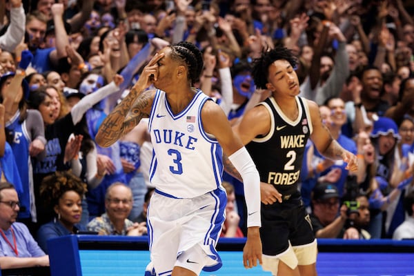 Duke's Isaiah Evans (3) reacts ahead of Wake Forest's Juke Harris (2) after hitting a 3-point basket during the first half of an NCAA college basketball game in Durham, N.C., Monday, March 3, 2025. (AP Photo/Ben McKeown)