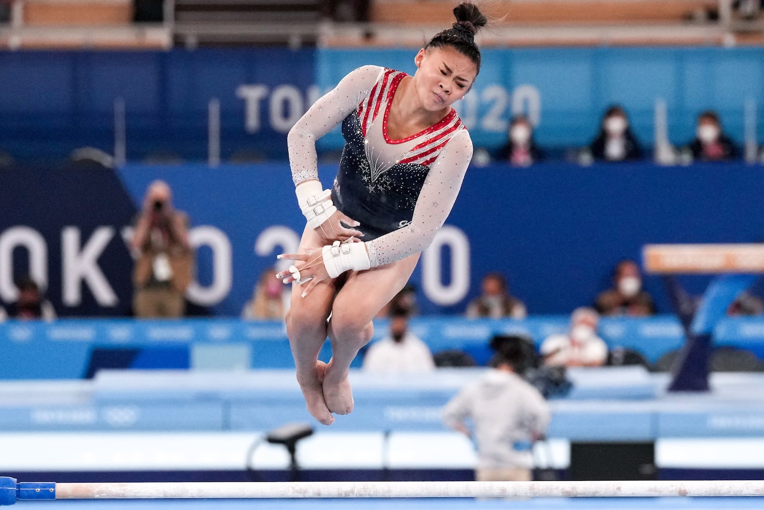 Sunisa Lee of the United States performs on the uneven bars during the women's all-around gymnastics competition at the postponed 2020 Tokyo Olympics in Tokyo on Thursday, July 29, 2021. (Chang W. Lee/The New York Times)