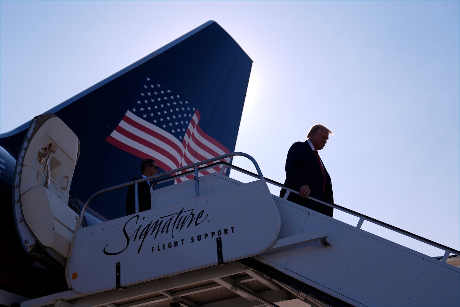 Republican presidential nominee former President Donald Trump arrives at Detroit Metropolitan Wayne County Airport, Friday, Oct. 18, 2024, in Detroit. (AP Photo/Evan Vucci)