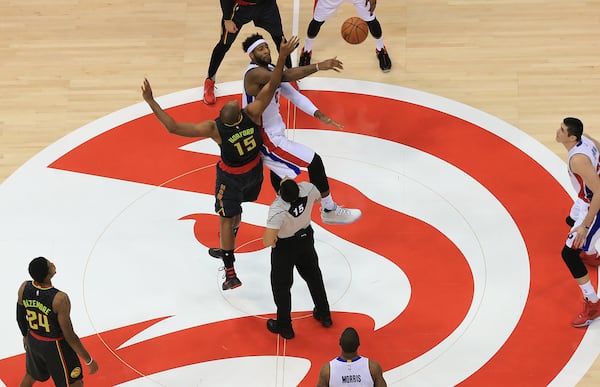 102715 ATLANTA: -- Hawks Al Horford battles Pistons Andre Drummond for the opening tip off to begin their first regular season basketball game "home opener" on Tuesday, Oct. 27, 2015, in Atlanta. Curtis Compton / ccompton@ajc.com