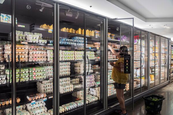 A woman shops for groceries in Manhattan on July 13, 2022. Hiroko Masuike/The New York Times