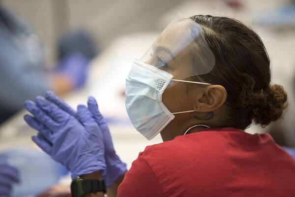 Sera Hazlewood of Conyers listens to her instructor during a hands on lab at the Georgia Institute of EMS in Covington. (Alyssa Pointer/alyssa.pointer@ajc.com)