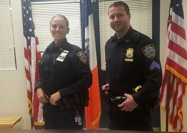 Rookie New York police Officer Brittany Roy, left, is pictured with her training officer, Sgt. Justin Dambiskaser, following a gun bust on Thursday, Oct. 26, 2017. Roy, whose police officer father was killed in the 9/11 terrorist attacks, graduated from the police academy on Monday.