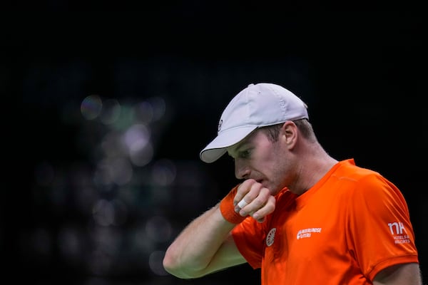 Netherlands' Botic van de Zandschulp reacts during his match against Italy's Matteo Berrettini during the Davis Cup final tennis match between Netherlands and Italy at the Martin Carpena Sports Hall in Malaga, southern Spain, on Sunday, Nov. 24, 2024. (AP Photo/Manu Fernandez)