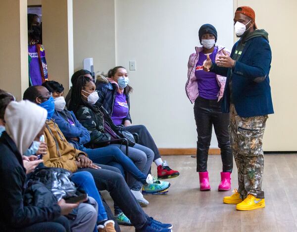 New Georgia Project regional organizer Brandt Lewis, right, talks to volunteers at the start of the vaccination clinic at the Our Lady of Lourdes Catholic Church on Martin Luther King, Jr. Day. (Steve Schaefer for The Atlanta Journal-Constitution)