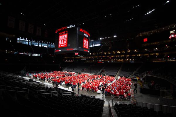 Volunteers fill the floor of State Farm Arena during the Million Meal event in 2019. About 5,000 people participated in the effort to alleviate hunger in metro Atlanta. Photo: The Atlanta Hawks