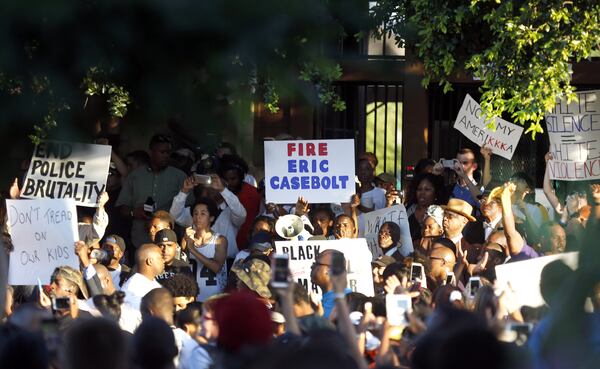 Hundreds gather outside a community pool during a protest Monday, June 8, 2015, in response to an incident at the pool involving McKinney police officers in McKinney, Texas. (AP Photo/Ron Jenkins)