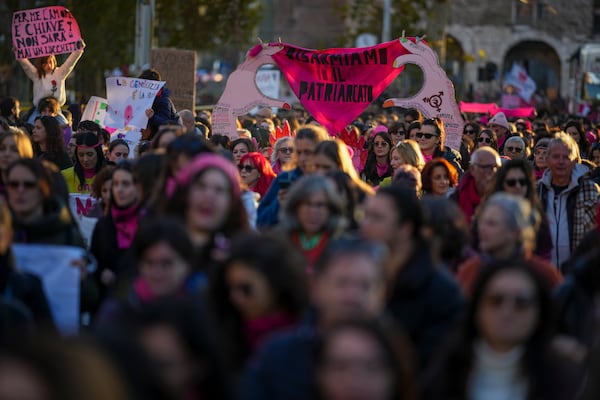 Demonstrators take part in a rally ahead of the International Day for the Elimination of Violence against Women which will be held on Nov. 25, in Rome, Saturday, Nov. 23, 2024. (AP Photo/Andrew Medichini)