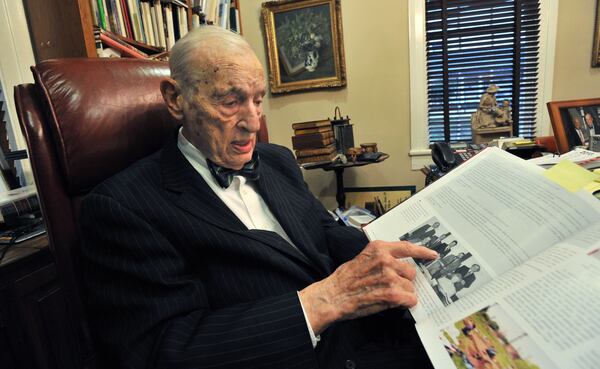 Fred Bentley Sr., in 2012, shows a copy  the book, Historic Kennesaw - 1887-2012 Celebrating 125 Years. HYOSUB SHIN / HSHIN@AJC.COM