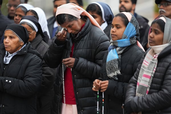 Nuns pray for Pope Francis in front of the Agostino Gemelli Polyclinic, where the Pontiff has been hospitalized since Feb.14, in Rome, Saturday, March 1, 2025. (AP Photo/Kirsty Wigglesworth)